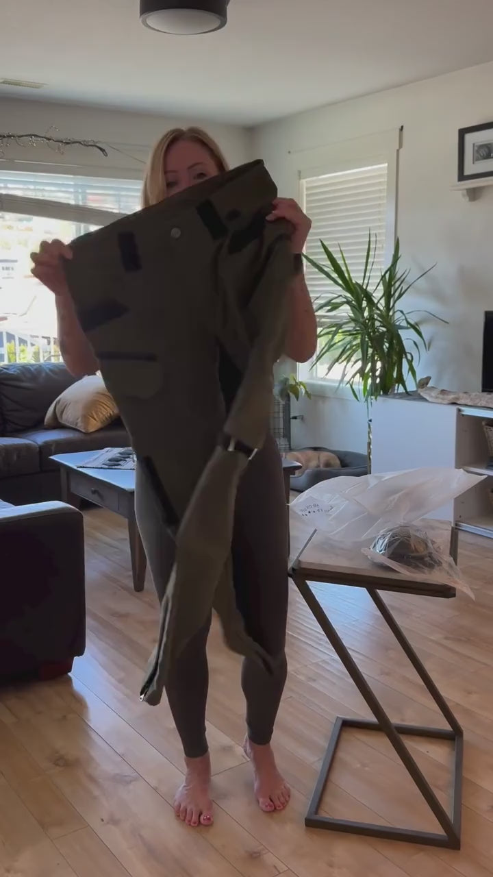 Customer video. A woman unboxes and tries on the Army Green RoadArmor Women's pants