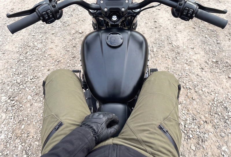 Customer photo. Woman's legs in the Army Green RoadArmor Women's pants on her Harley